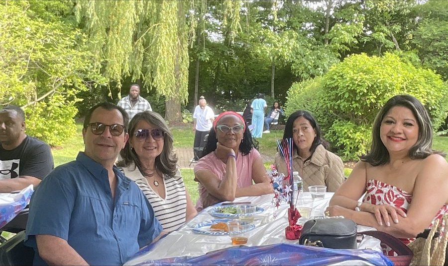 Family and friends at an outdoor crawfish boil celebration